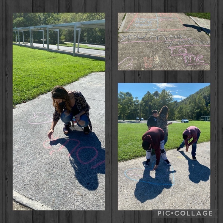 students using sidewalk chalk