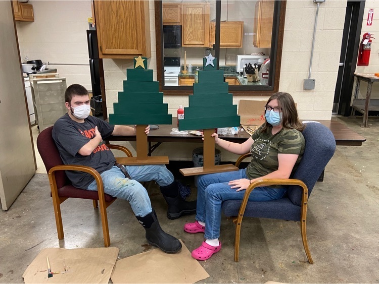 students with Christmas trees